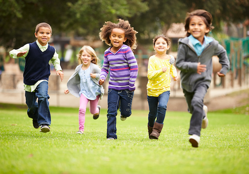 Happy children running in a park